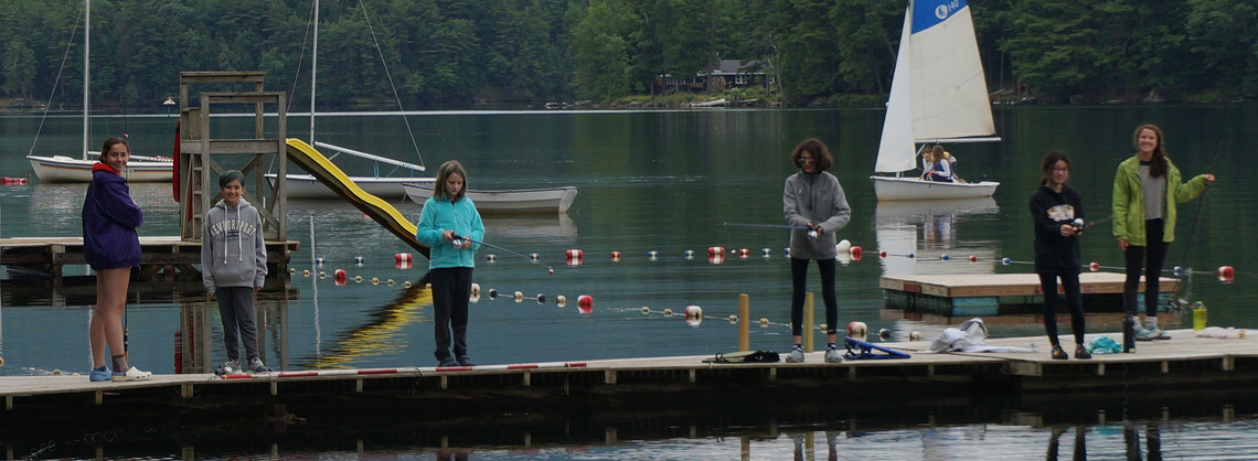 campers on dock fishing