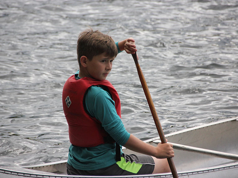 Boy in Canoe on lake
