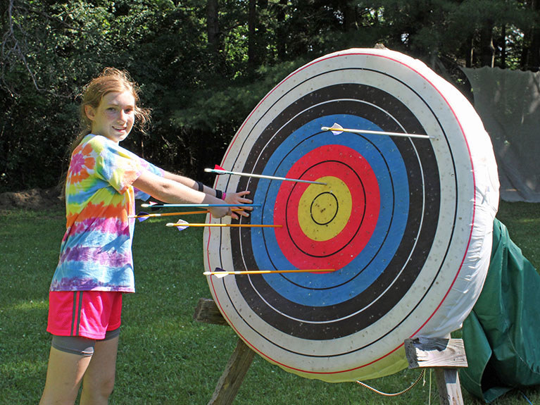 Girl at archery target