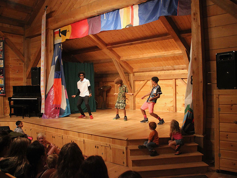 campers dancing on stage