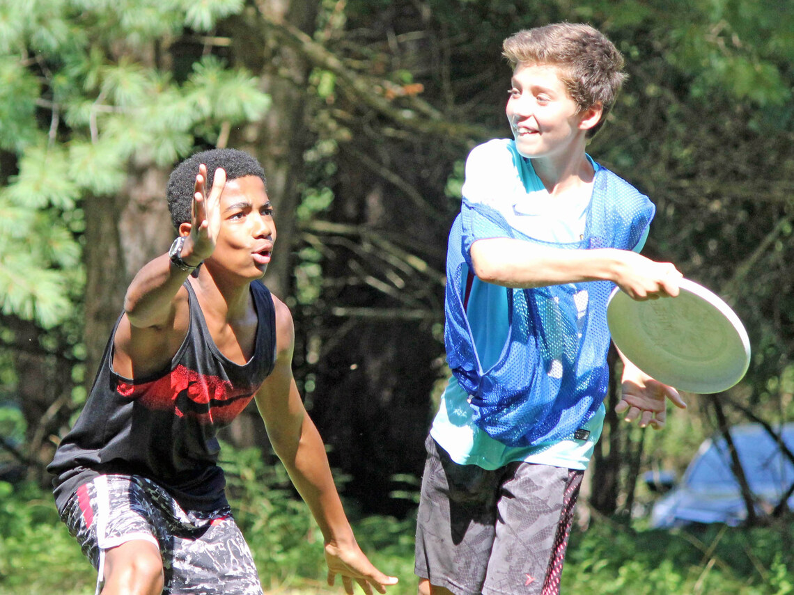 campers playing frisbee