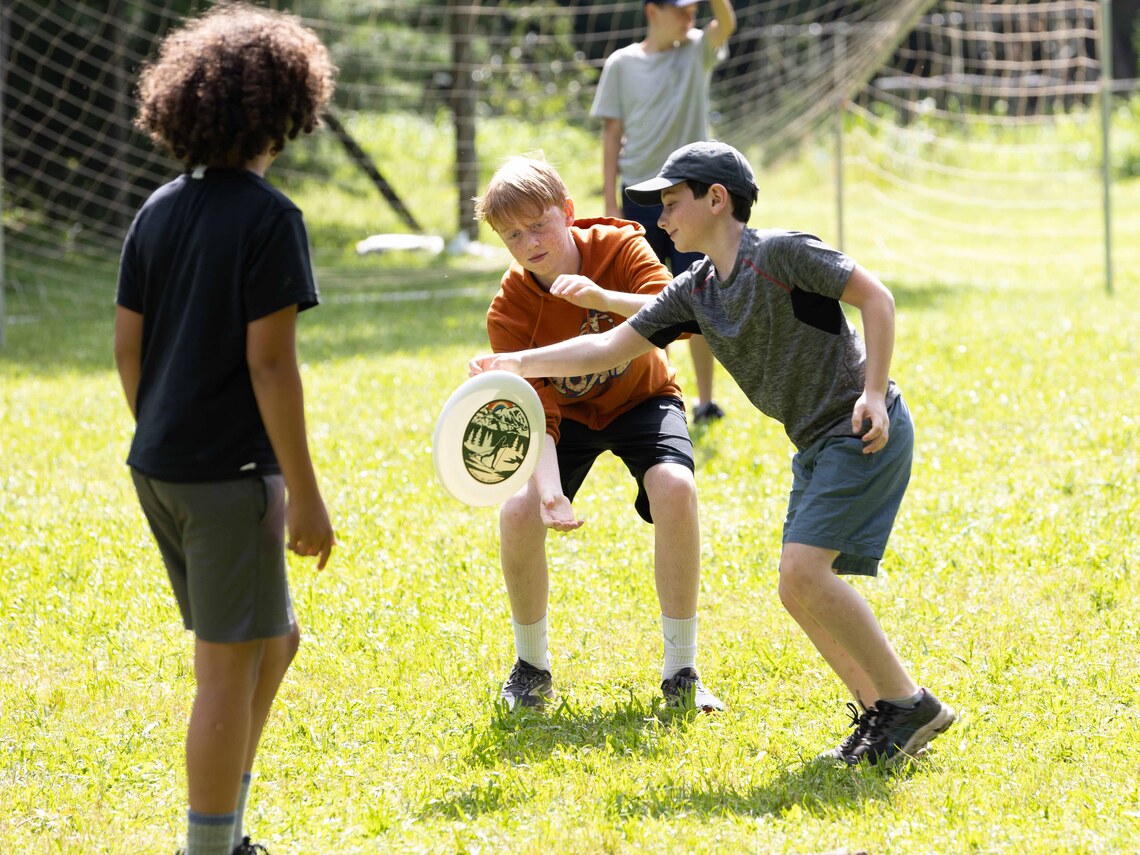 campers playing frisbee