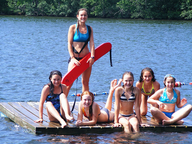 group of campers on dock after swimming