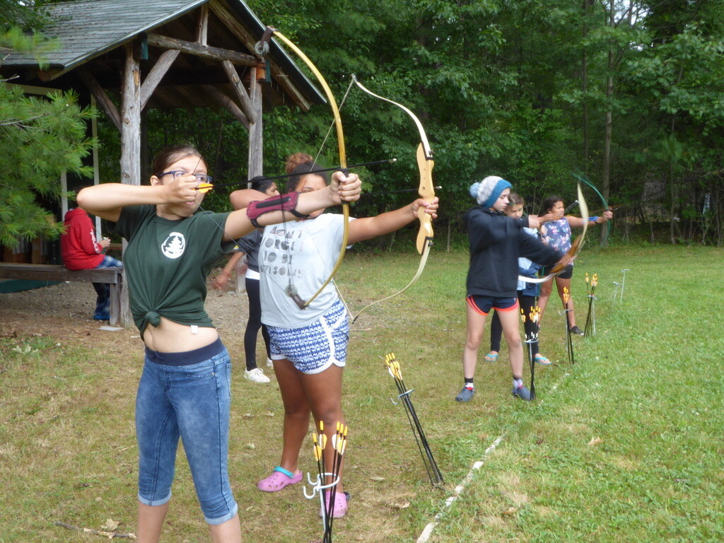 Girls shooting arrows