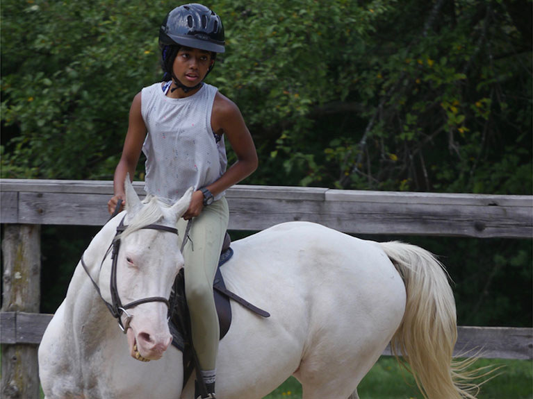 Girl riding horse